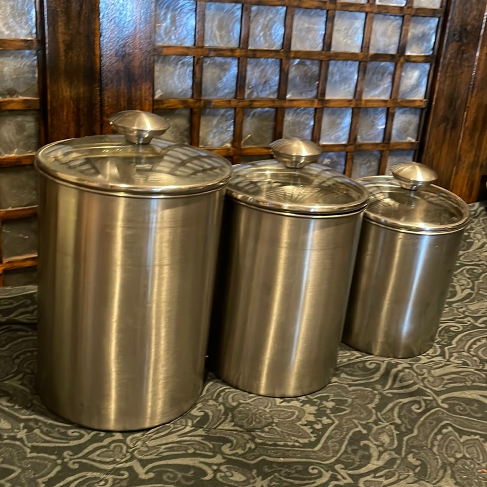 3 stainless steel canisters with glass covers